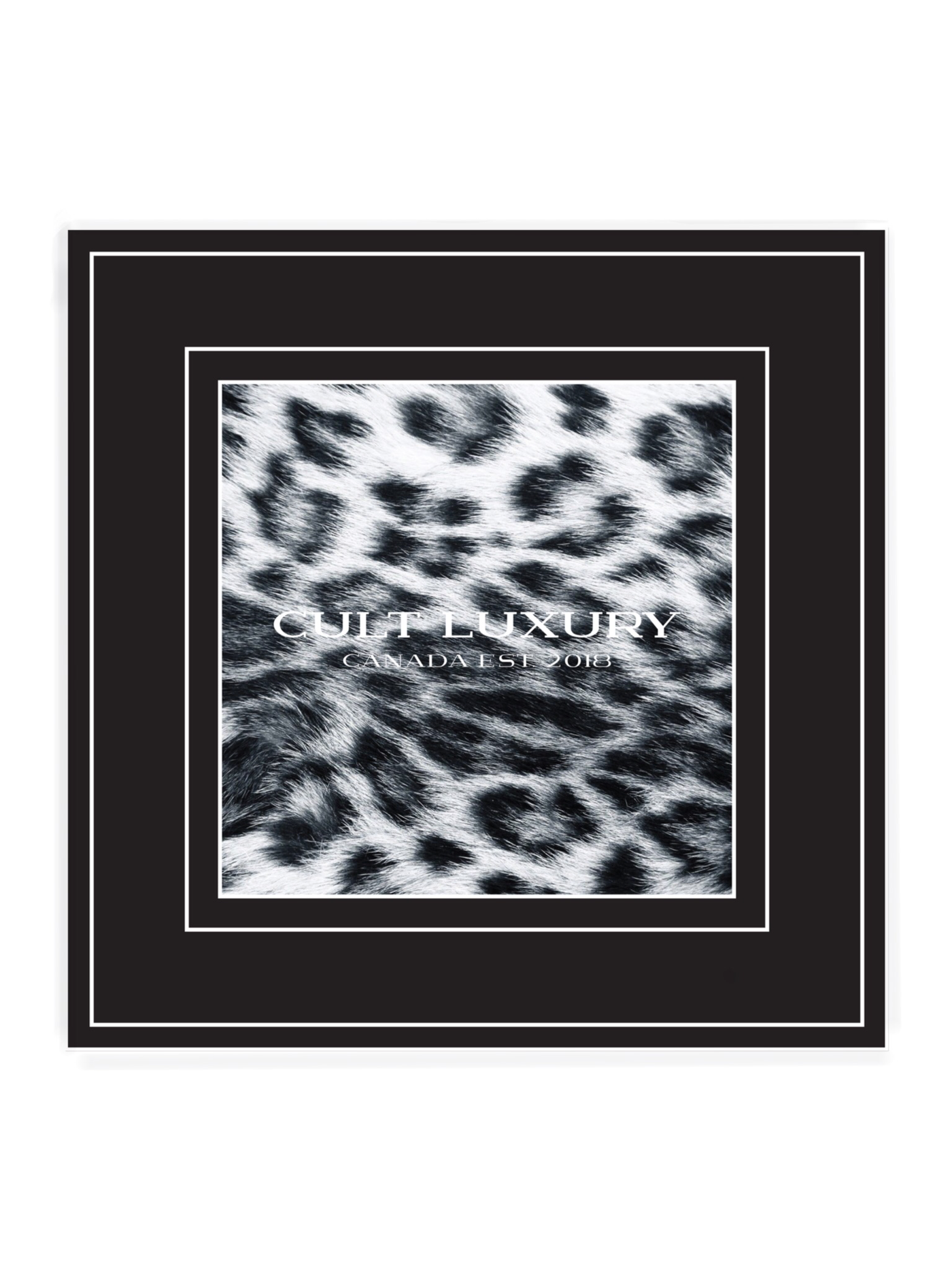 Flat lay of Black Snow Leopard 90 silk scarf, minimal animal print on high-quality silk twill.