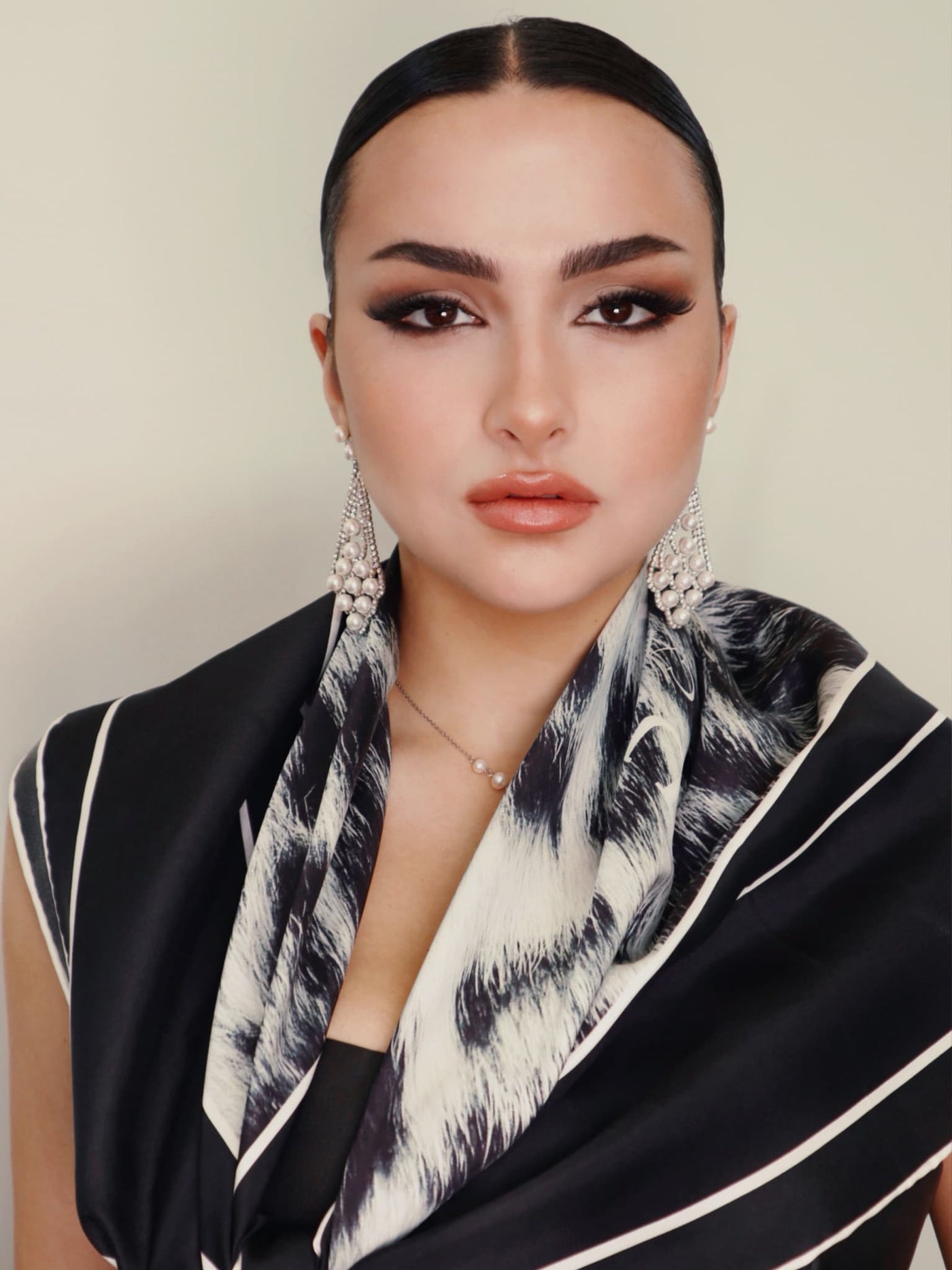 Model styled in Black Snow Leopard scarf, full view, featuring elegant draping and sharp luxury print.