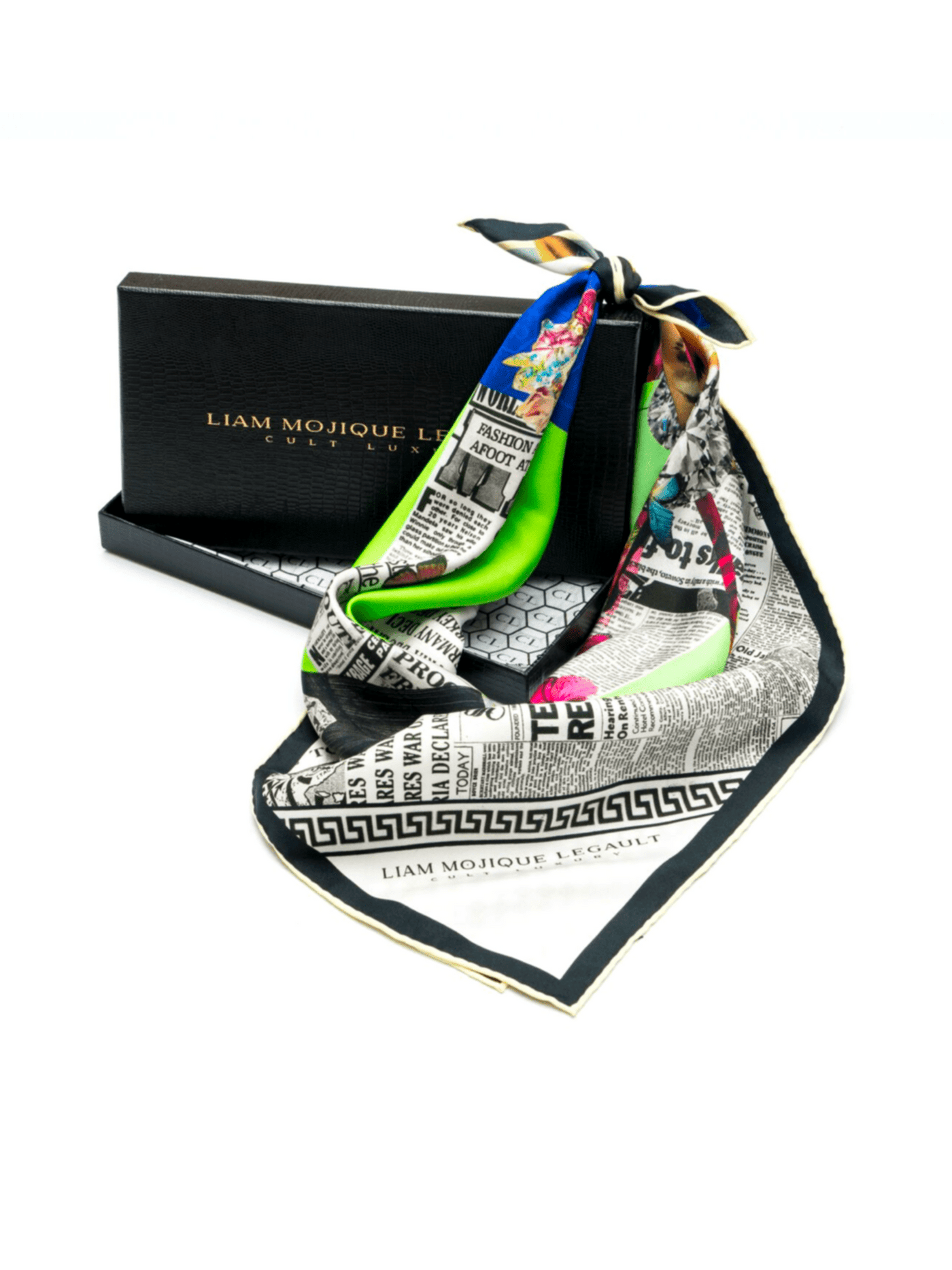 Luxury silk scarf, Butterfly Season 2, styled in its Cult Luxury black storage box, featuring intricate prints and vivid green accents.