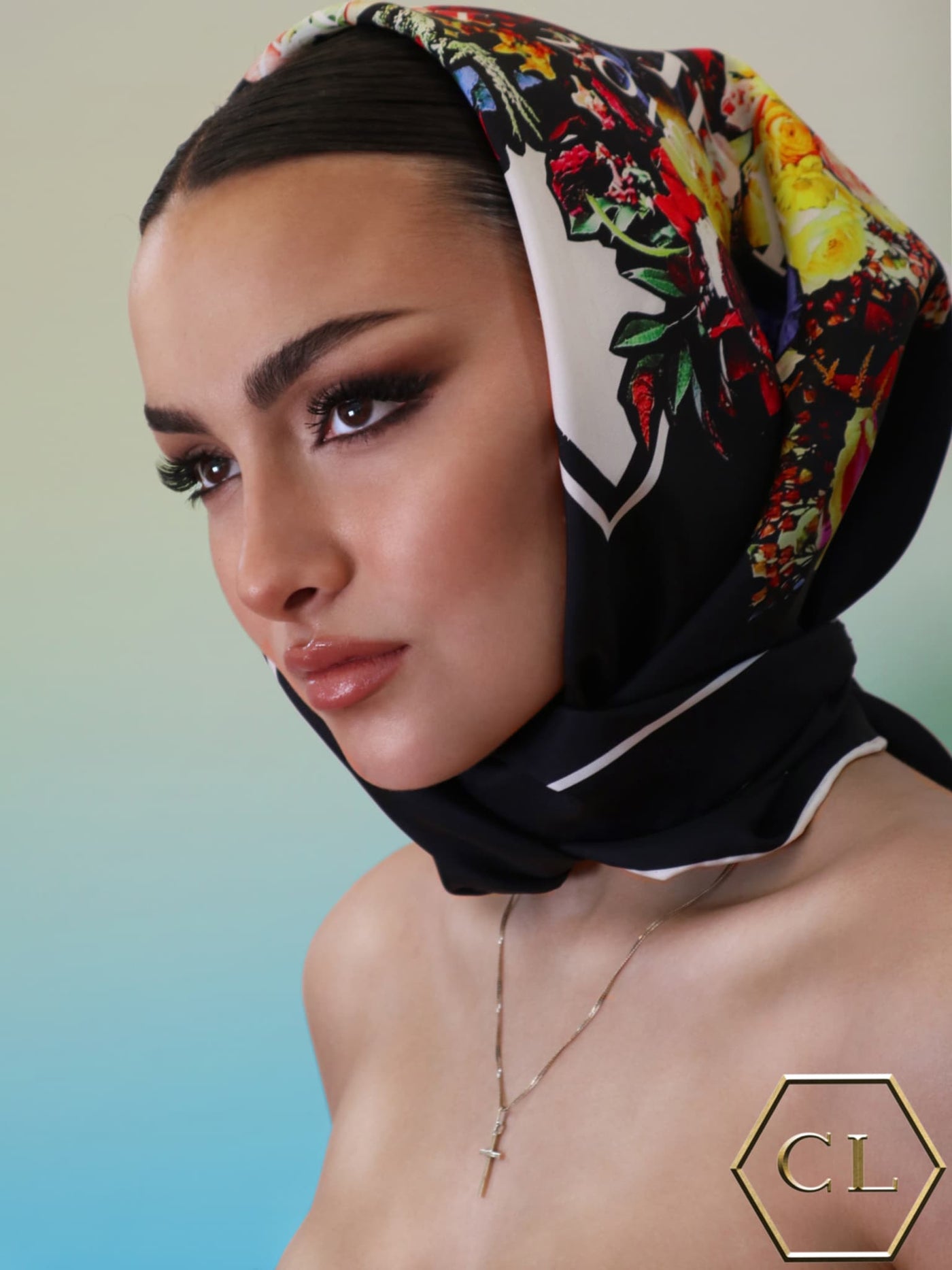 Model styled with Cult Luxury’s Black Bouquet 90 silk scarf as a head wrap, showcasing the intricate floral design and luxurious fine art on fabric.