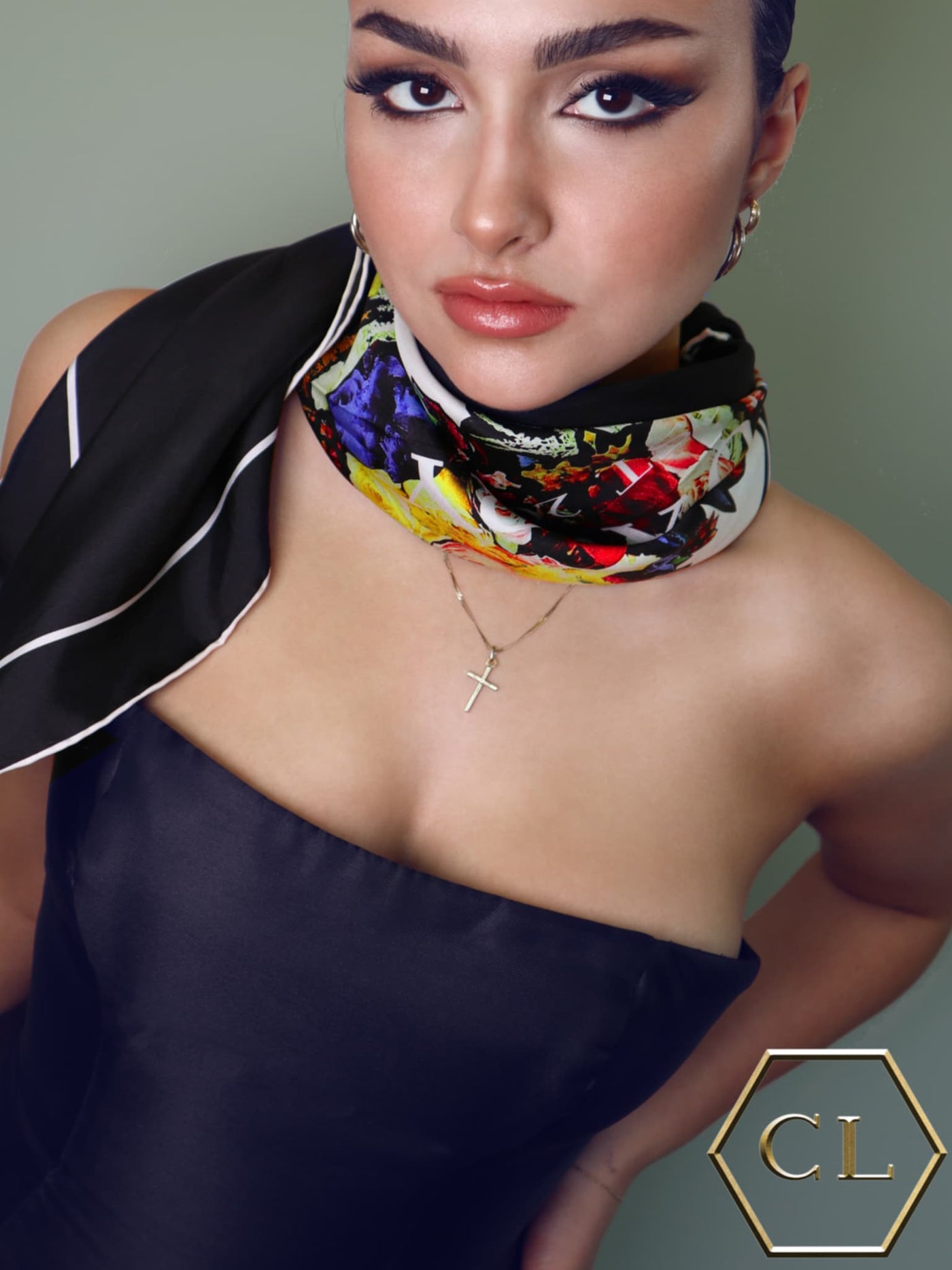 Close-up of model wearing the Black Bouquet 90 silk scarf around her neck, highlighting the vibrant floral details and high-quality silk fabric.