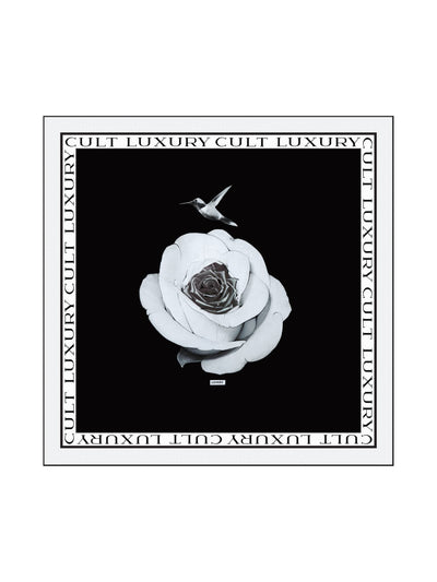 Cult Luxury Black Rose 90 silk scarf featuring a delicate black rose within a white rose and a hummingbird, surrounded by a bold Cult Luxury monogram border, designed for FW24