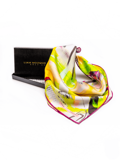 Luxury silk scarf presented with its signature Cult Luxury black storage box, highlighting the 100% silk twill quality and hand-rolled finish.