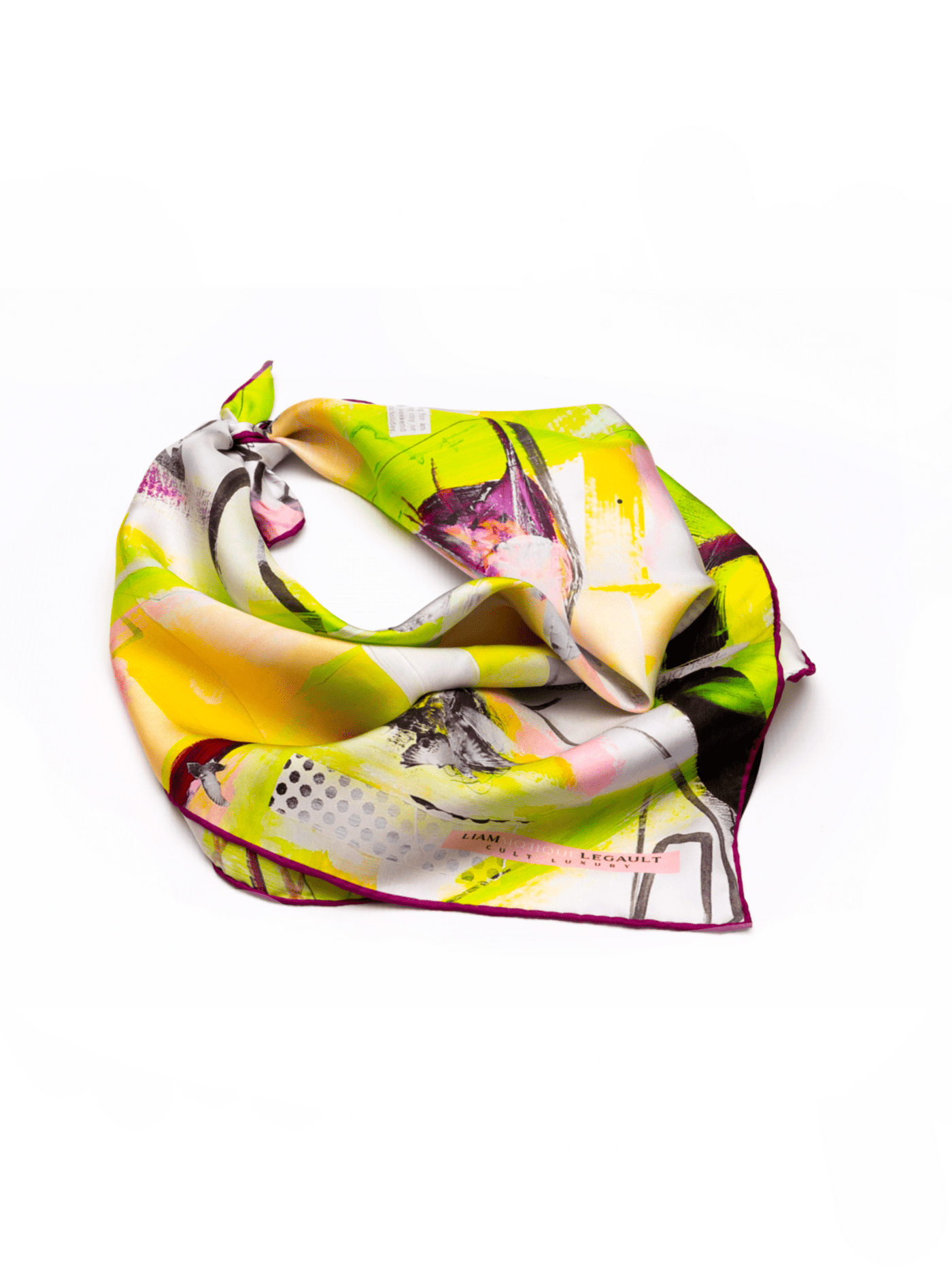 Flatlay of Cult Luxury silk accessory, a hand-rolled 65 cm silk twill scarf in green, yellow, and pink hues with intricate design details.