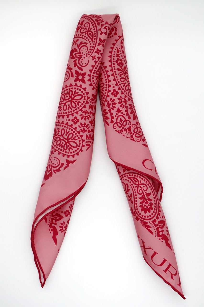 Folded Coral Silk Bandana by Cult Luxury, showcasing the detailed coral pattern and high-quality silk craftsmanship